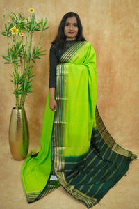 IS6118 Lime Green and Bottle Green Georgette Viscose saree with floral gold zari border.