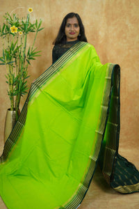 IS6118 Lime Green and Bottle Green Georgette Viscose saree with floral gold zari border.