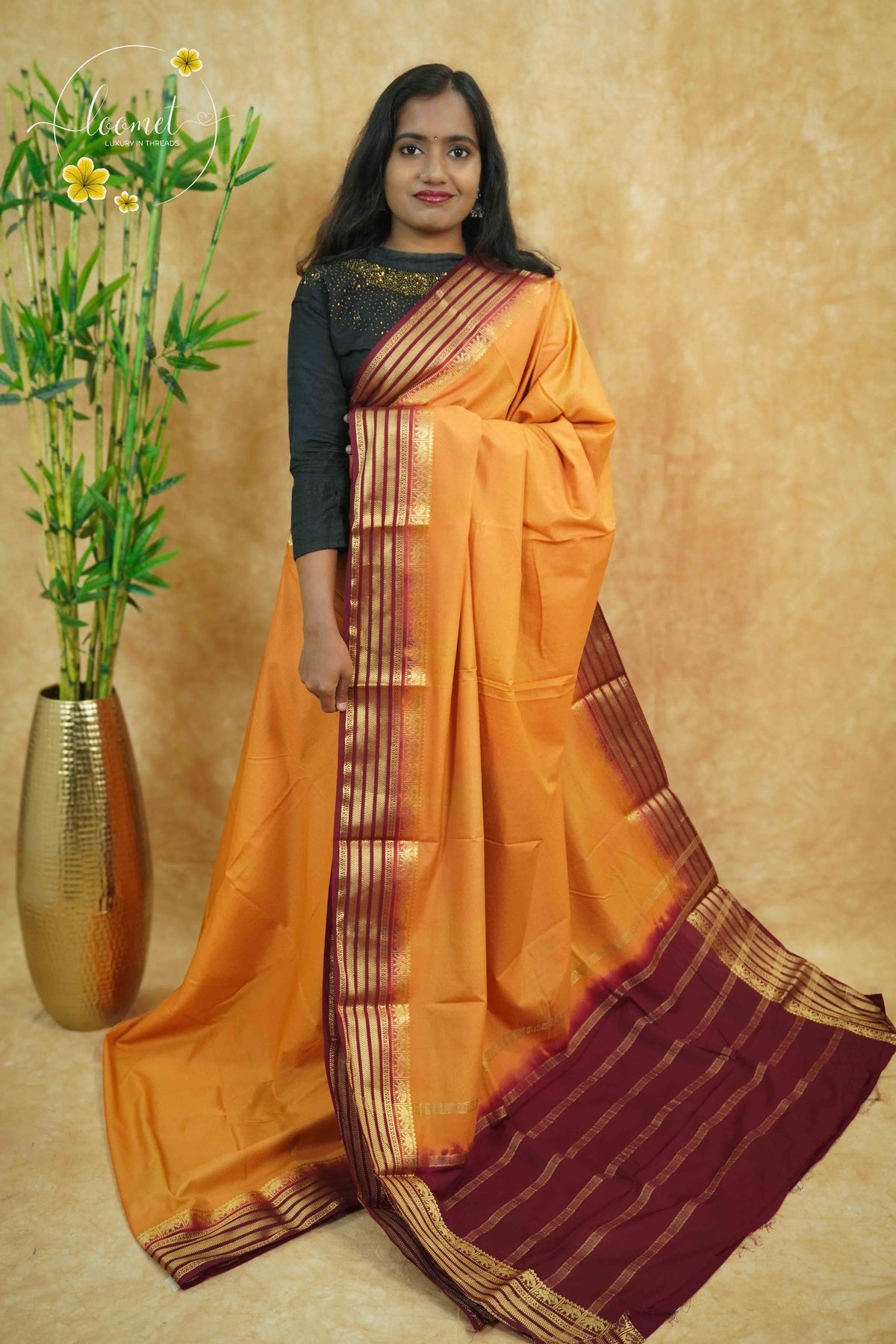 IS6119 Mango Gold and Deep Maroon Georgette Viscose saree with floral gold zari border.
