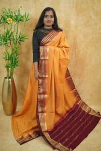 IS6119 Mango Gold and Deep Maroon Georgette Viscose saree with floral gold zari border.