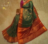 ISS4341 Deep Emerald Green & Copper-Rust Semi Soft silk saree featuring a Grid-Check Pattern.