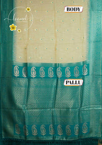 ISS8315 Off-White and teal green Banarasi Semi Cotton saree with floral motifs.