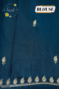 IWS4111 Aqua Blue Tissue Organza saree with silver sequin  buttas shaped like small leaves.