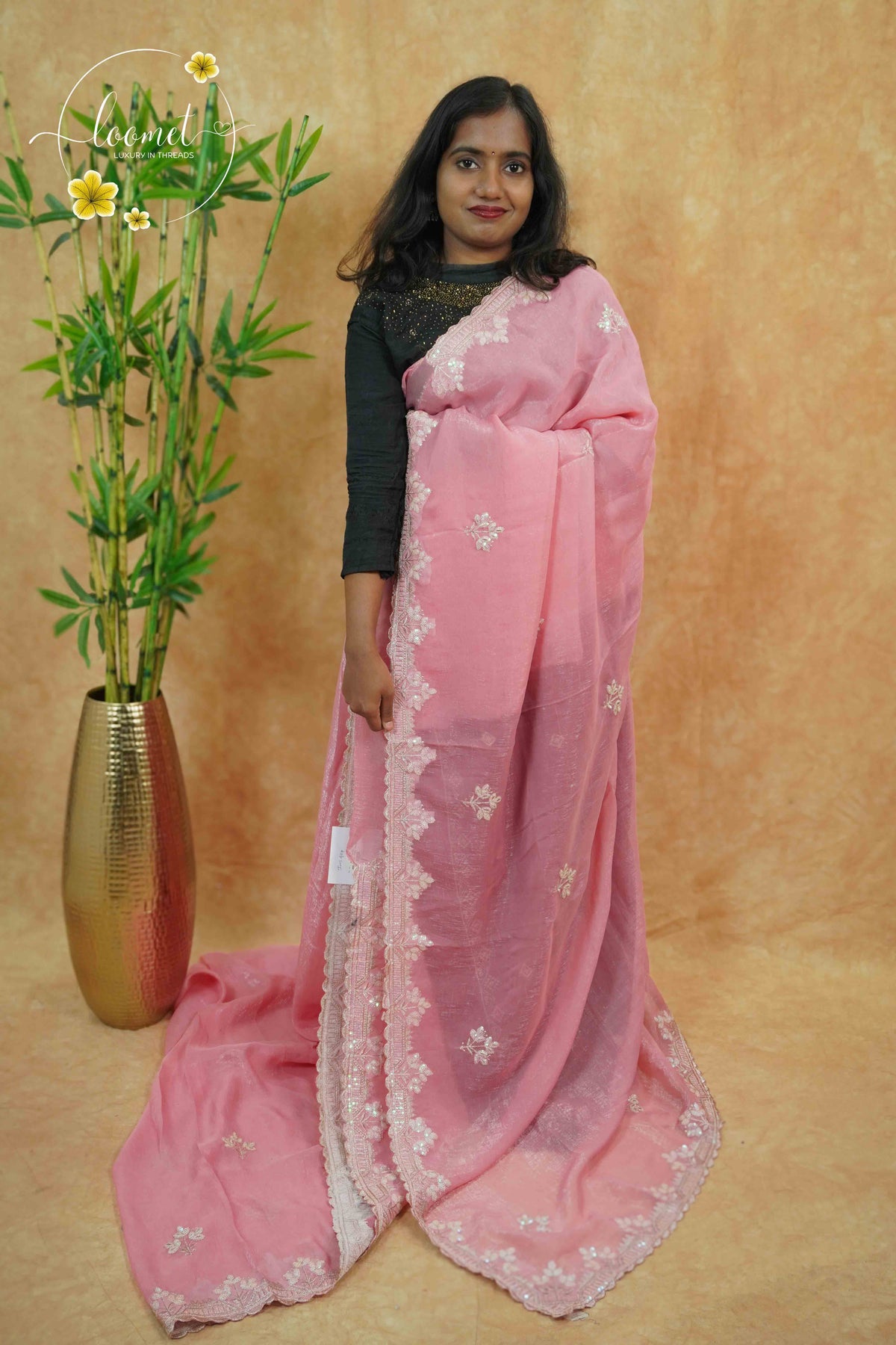 IWS4114 Pink Tissue Organza saree with silver sequin buttas shaped like small leaves.