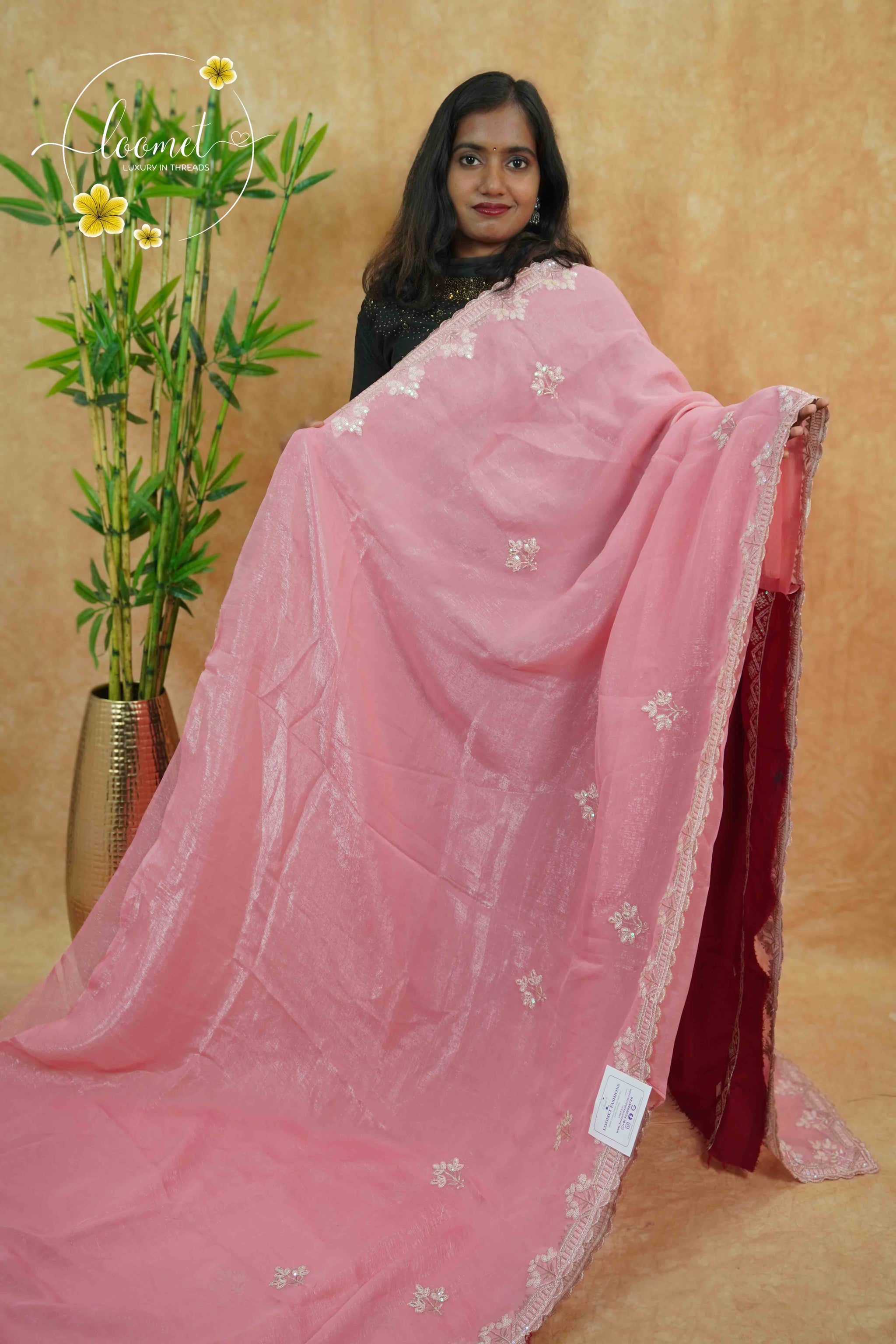 IWS4114 Pink Tissue Organza saree with silver sequin buttas shaped like small leaves.