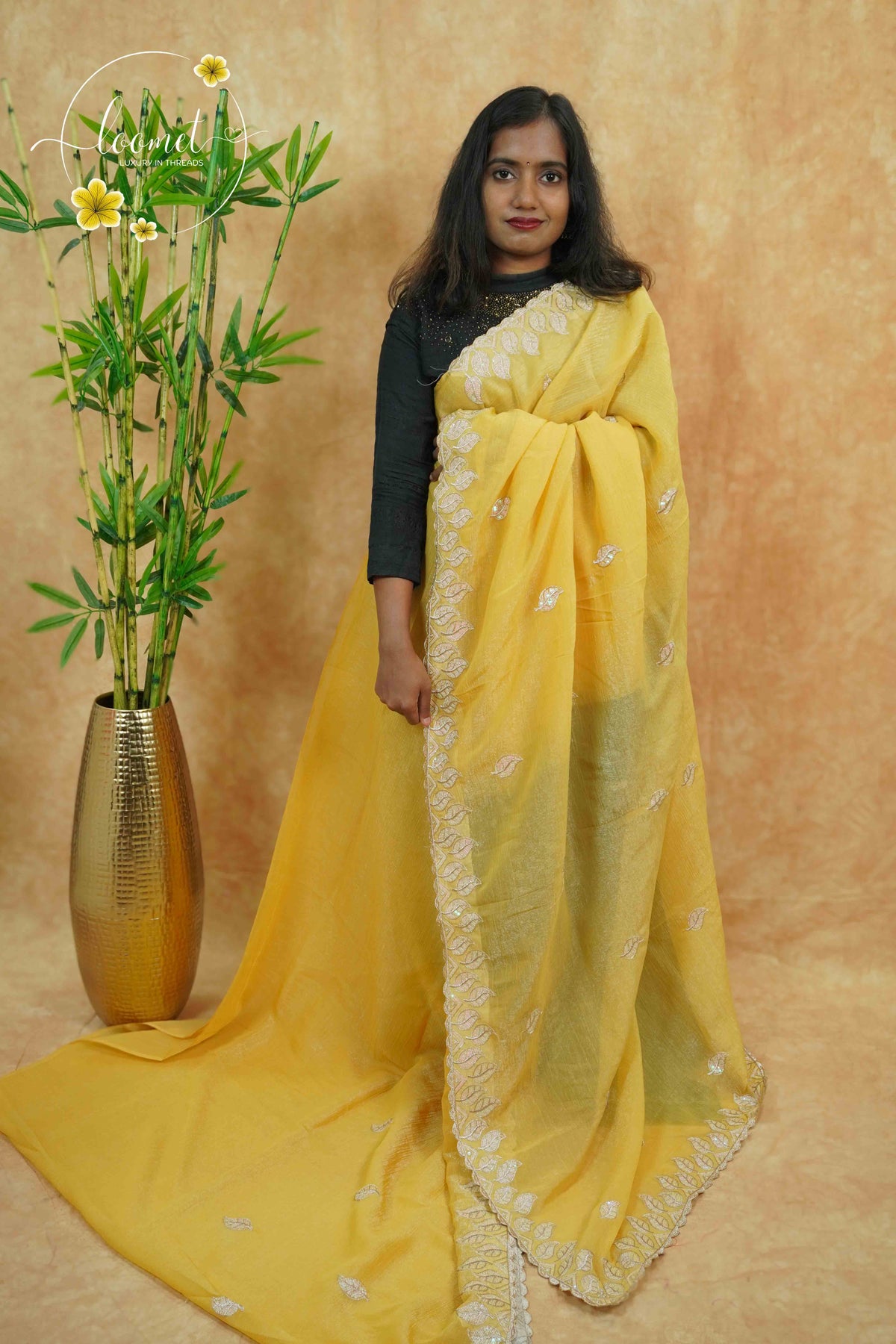 IWS4116 Golden Yellow Tissue Organza saree with silver sequin buttas shaped like small leaves.