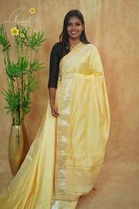 IWS4332 Lemon yellow Semi Tussar Silk saree with a silver checked zari border.