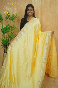 IWS4332 Lemon yellow Semi Tussar Silk saree with a silver checked zari border.