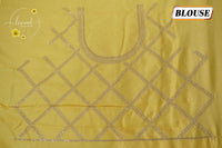 IWS4332 Lemon yellow Semi Tussar Silk saree with a silver checked zari border.
