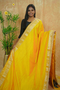 IWS4333 Chrome Yellow semi tussar silk saree with a silver checkered zari border.
