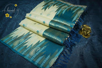 IWS8002 Off-White and Teal Blue Banarasi semi cotton saree with Arrow-shaped Buttas.