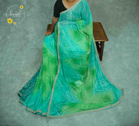 KST6142 Turquoise and Green Georgette saree with Marble-Effect Tie-Dye and Sequin embroidery.