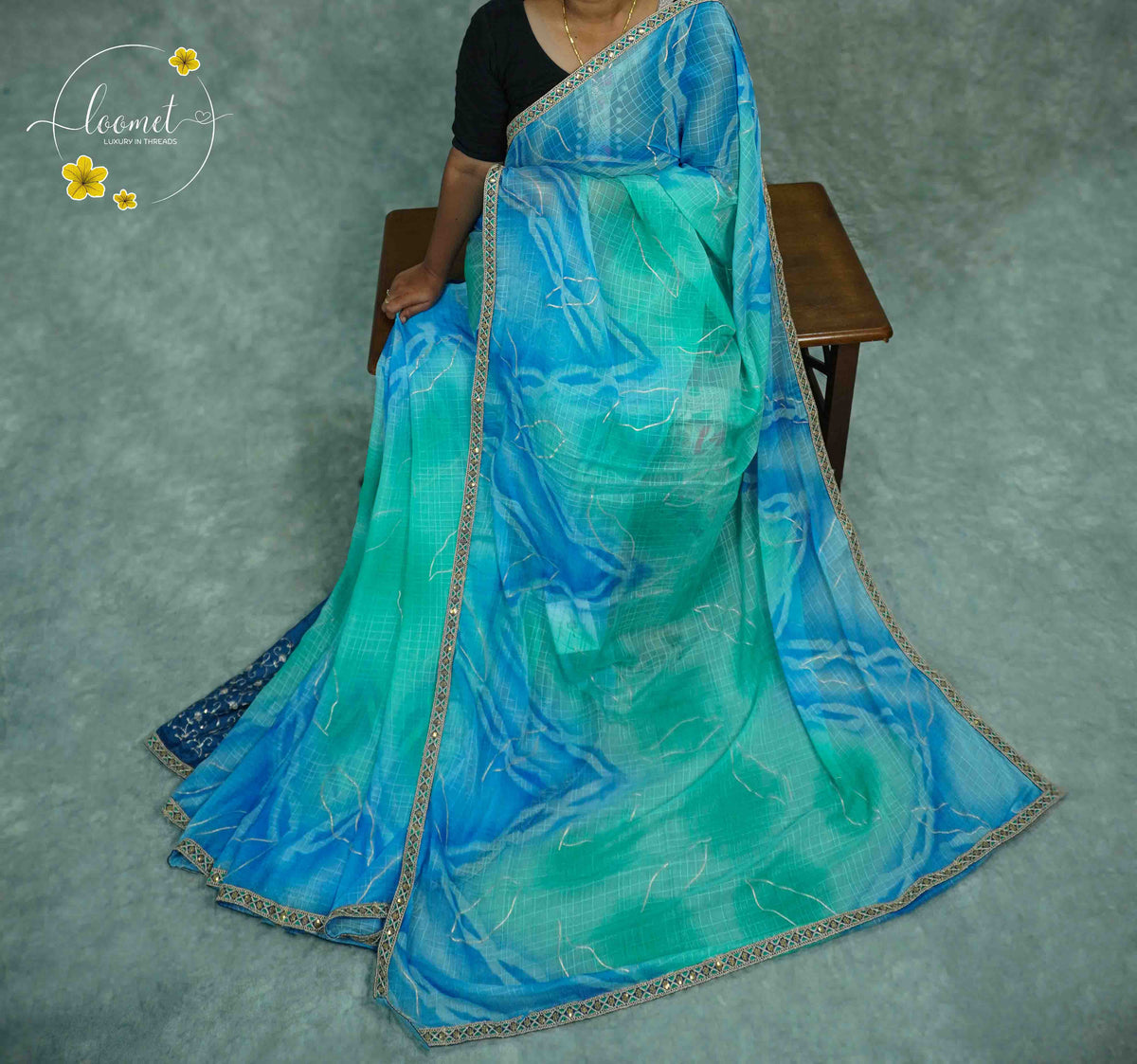 KST6146 Blue and Teal Georgette saree with Marble-Effect Tie-Dye and Sequin embroidery.