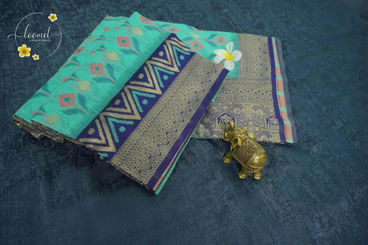 KST7131 Seafoam green Pochampalli Silk-Cotton saree featuring ikat-style buttas.