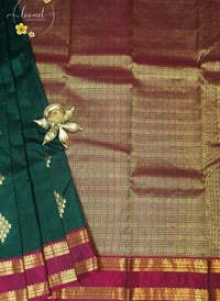 LSK6118 Emerald Green silk saree with small gold brocade motifs, featuring a striking maroon pallu and border.