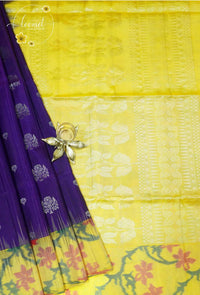 LSK6120 Royal purple and lemon-yellow silk saree with white floral motifs, dramatically contrasted by a yellow pallu featuring bold floral brocade.