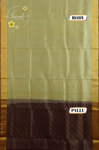 LSK6122 Cream and maroon silk saree contrasted by a dense maroon pallu woven with intricate gold geometric patterns.