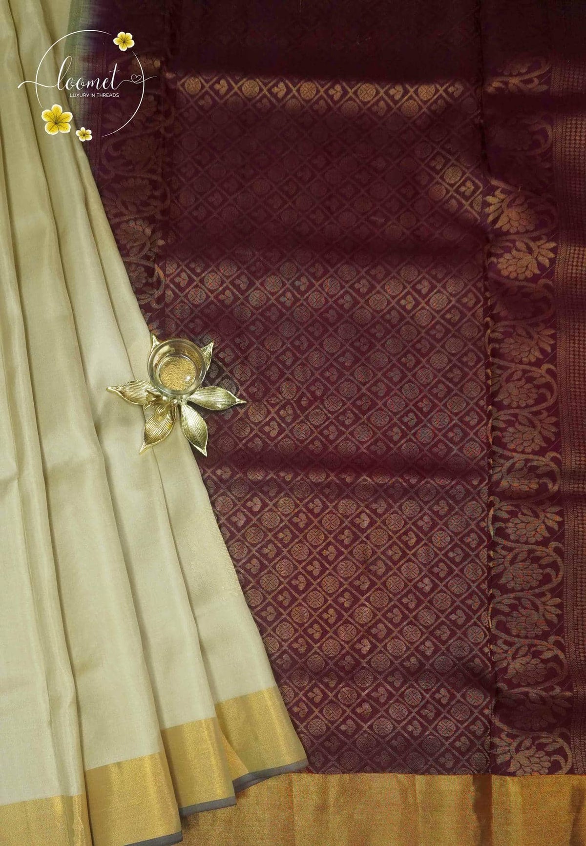 LSK6122 Cream and maroon silk saree contrasted by a dense maroon pallu woven with intricate gold geometric patterns.