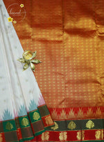 LSK6129 White silk saree with multicoloured Ikat-style temple design and gold pallu with gold zari motifs.