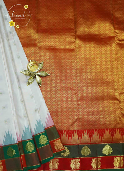 LSK6129 White silk saree with multicoloured Ikat-style temple design and gold pallu with gold zari motifs.