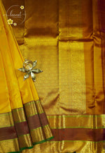 LSK6132 Mustard yellow silk saree with a magnificent antique gold brocade pallu densely woven with intricate gold brocade patterns and broad borders.