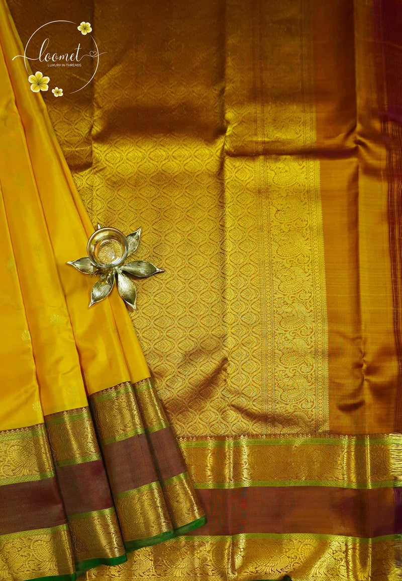 LSK6132 Mustard yellow silk saree with a magnificent antique gold brocade pallu densely woven with intricate gold brocade patterns and broad borders.