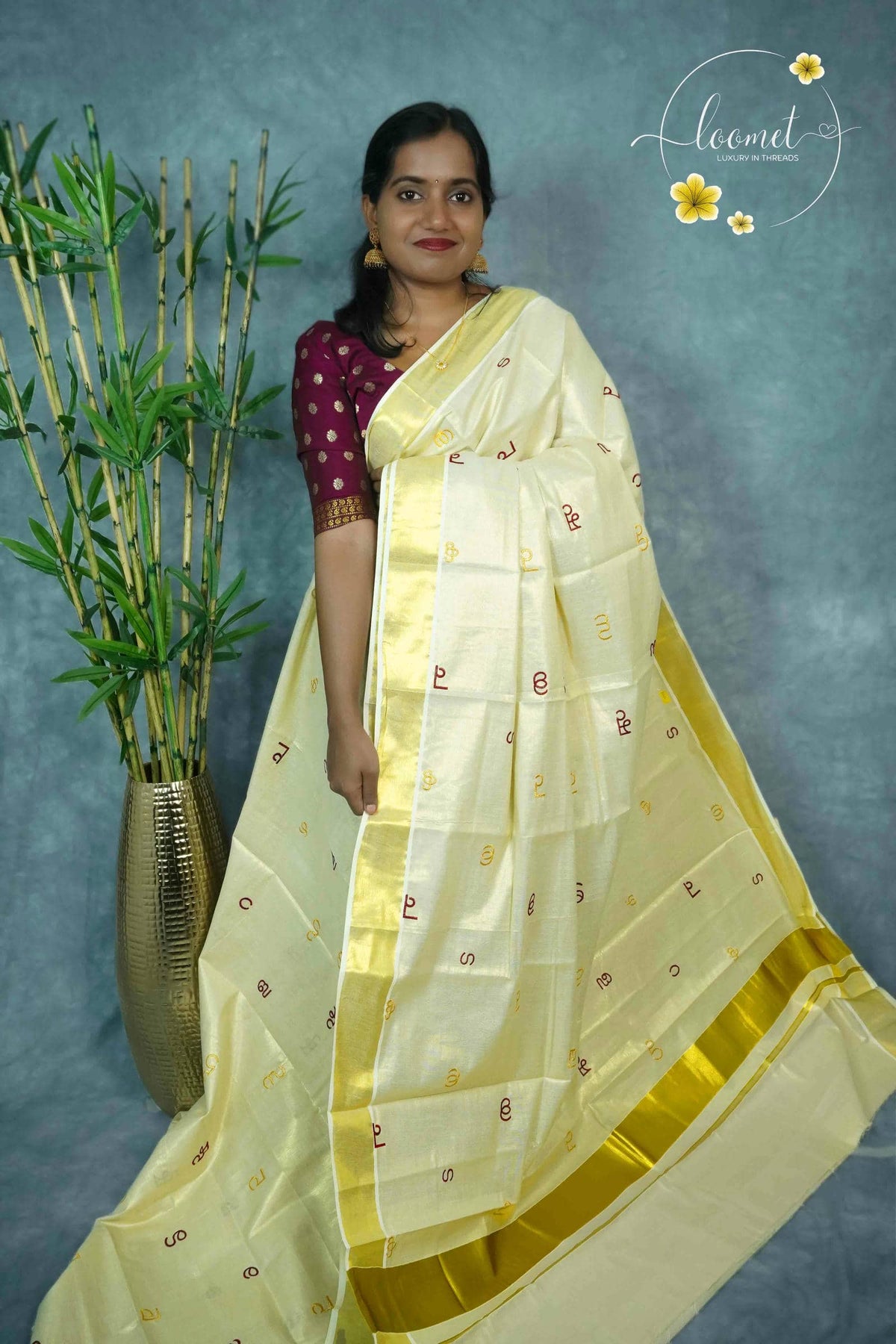 MKF3261 Light Gold Cotton Tissue saree with Malayalam Letter Motifs