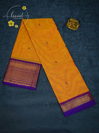 MPS1653 Mustard Yellow Kanchi cotton saree with gold zari buttas and wavy pattern.