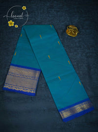 MPS1654 Turquoise Blue Kanchi cotton saree with gold zari buttas and wavy pattern.