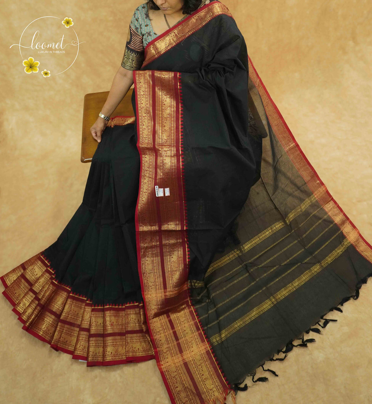 NKS1020 Jet Black Handloom Cotton saree with plain body pattern.