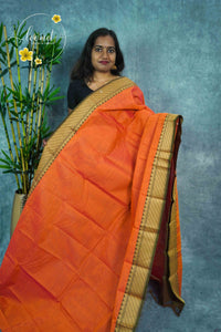 NKS1040 Orange Handloom Cotton saree with plain body pattern.