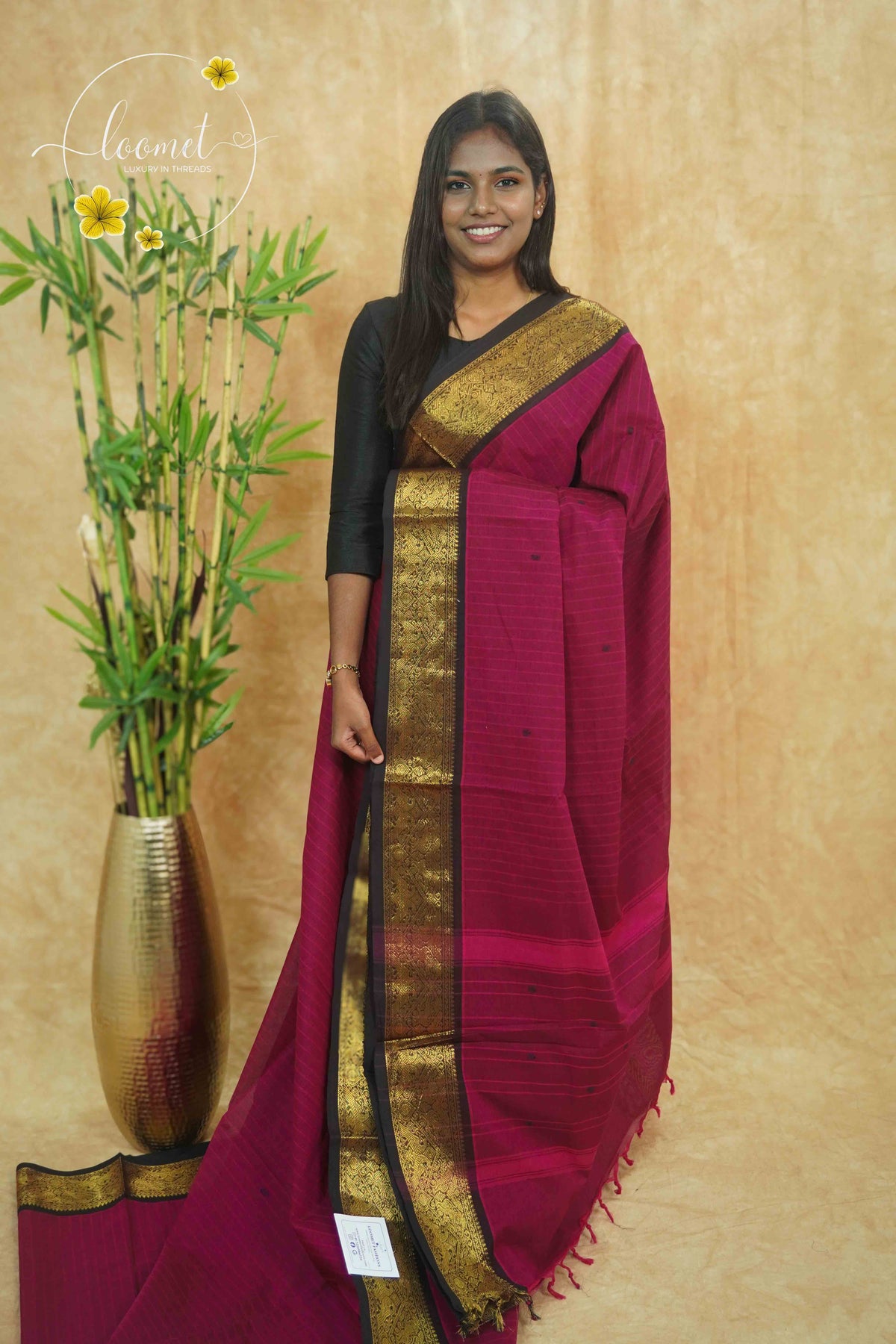 NLS1070 Magenta Handloom Cotton saree with horizontal self-stripes and woven black buttas.