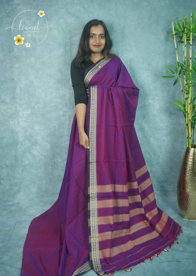 NLS1116 Purple saree features a solid body and a contrasting navy blue border adorned with cream-colored paisley and geometric motifs.