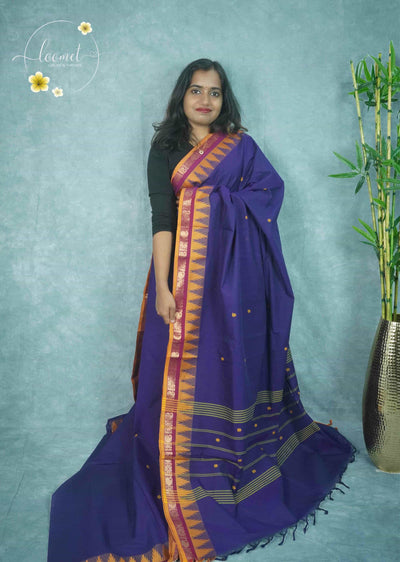 NLS1331 Royal blue cotton saree features a mustard temple border, maroon paisley zari work, and green vertical stripes on the pallu.