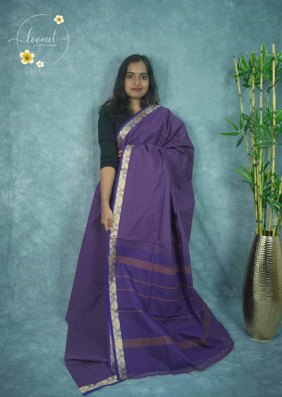 NLS5111 Blue saree features thin orange checks and a striking golden zari border with elegant floral and leaf patterns.