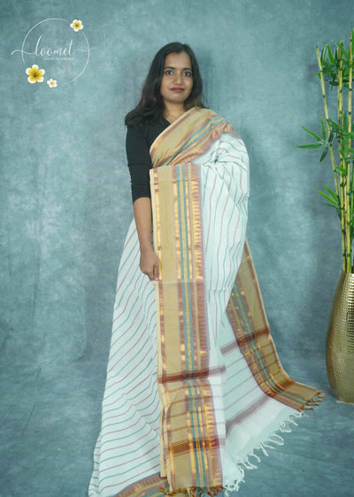 NLS5211 Elegant white saree features horizontal patterned stripes and a broad beige border with colourful bands and golden temple motifs.