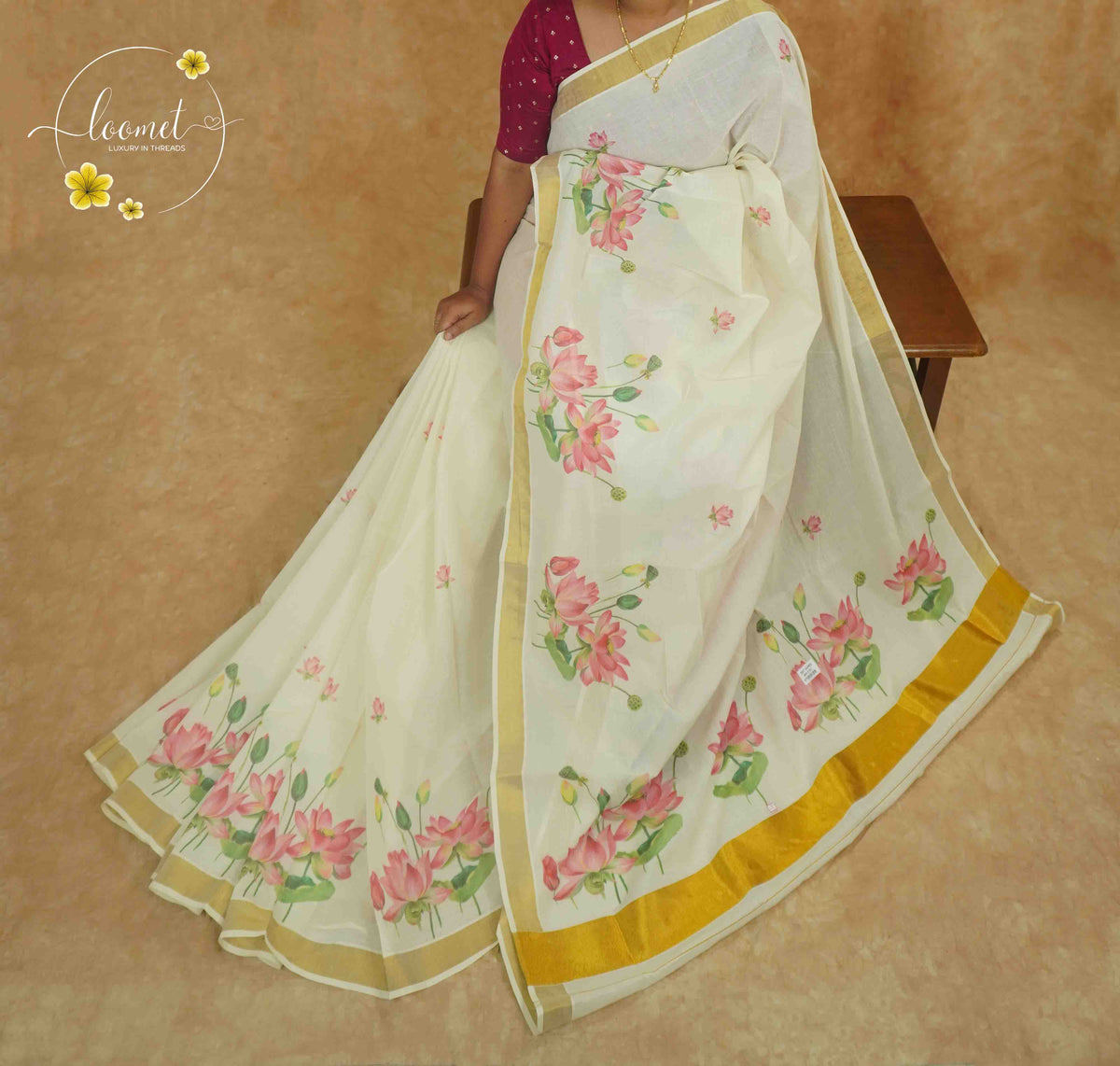 RKT2132 Off-White Kerala Cotton saree with hand-block printed pink lotuses and golden kasavu border.
