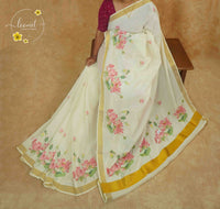 RKT2132 Off-White Kerala Cotton saree with hand-block printed pink lotuses and golden kasavu border.