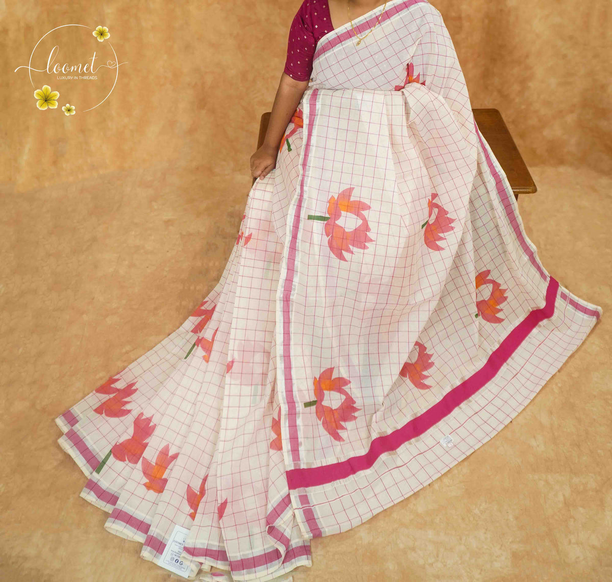 RKT2133 Off-White Kerala Cotton saree with pink windowpane checks and hand-block printed lotus motifs.