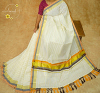 RKT2141 Off-White Kerala Cotton saree with Elegant Zari Pinstripes, Multi-Hued Borders, and Handcrafted Tassels.