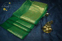 RS1612 Emerald Green Matka silk saree with floral and paisley circular motifs.