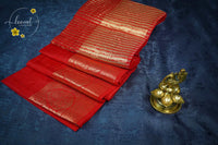 RS1613 Crimson red Matka silk saree with floral and paisley circular motifs.