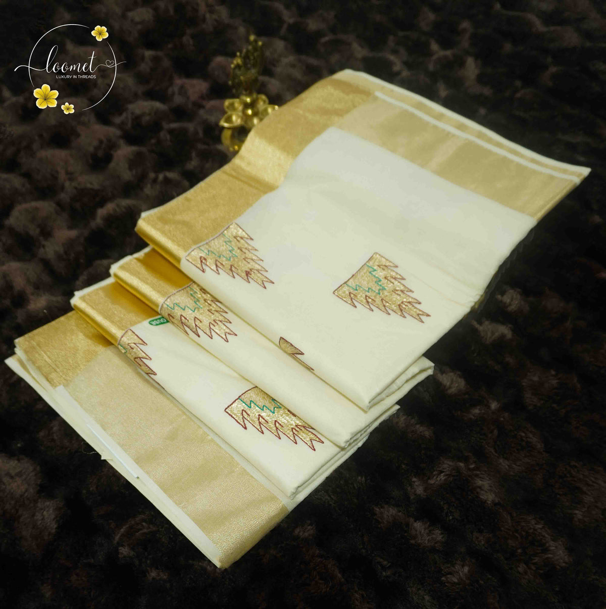 SDS1501 Off-White Kerala Cotton saree with golden kasavu border and temple spire buttas.