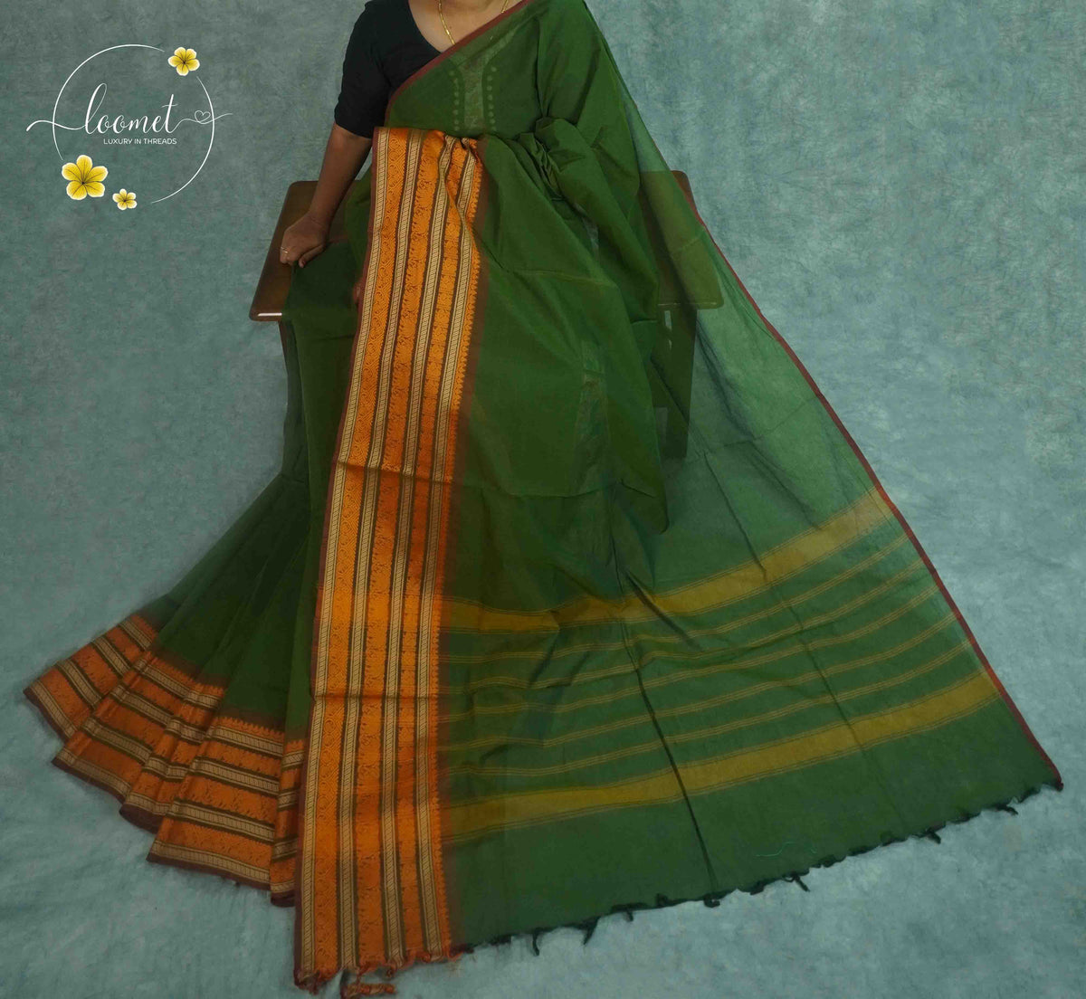 SKV2311 Olive green Cotton saree featuring mustard-orange and maroon woven borders.