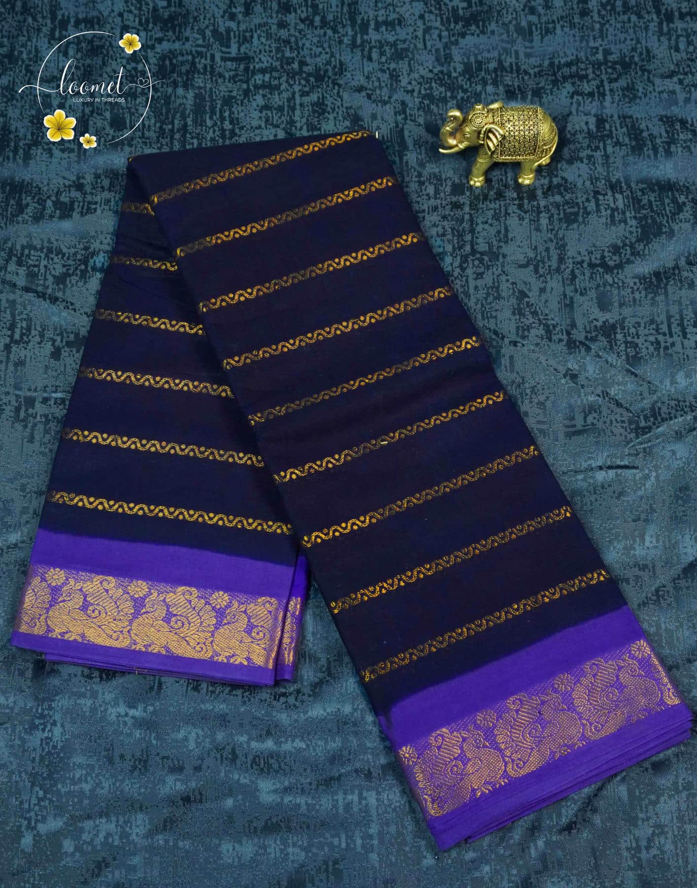SPT3141 Navy blue saree with horizontal gold zari stripes with antique gold brocade motifs on a solid royal purple base.