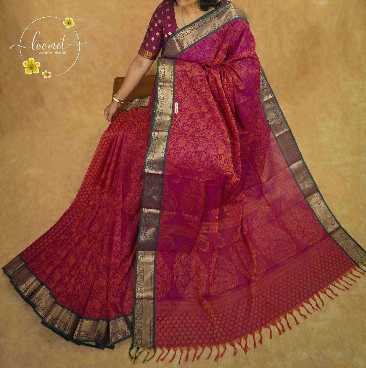 SSK1050 Magenta Cotton saree with self-jacquard peacock motifs.